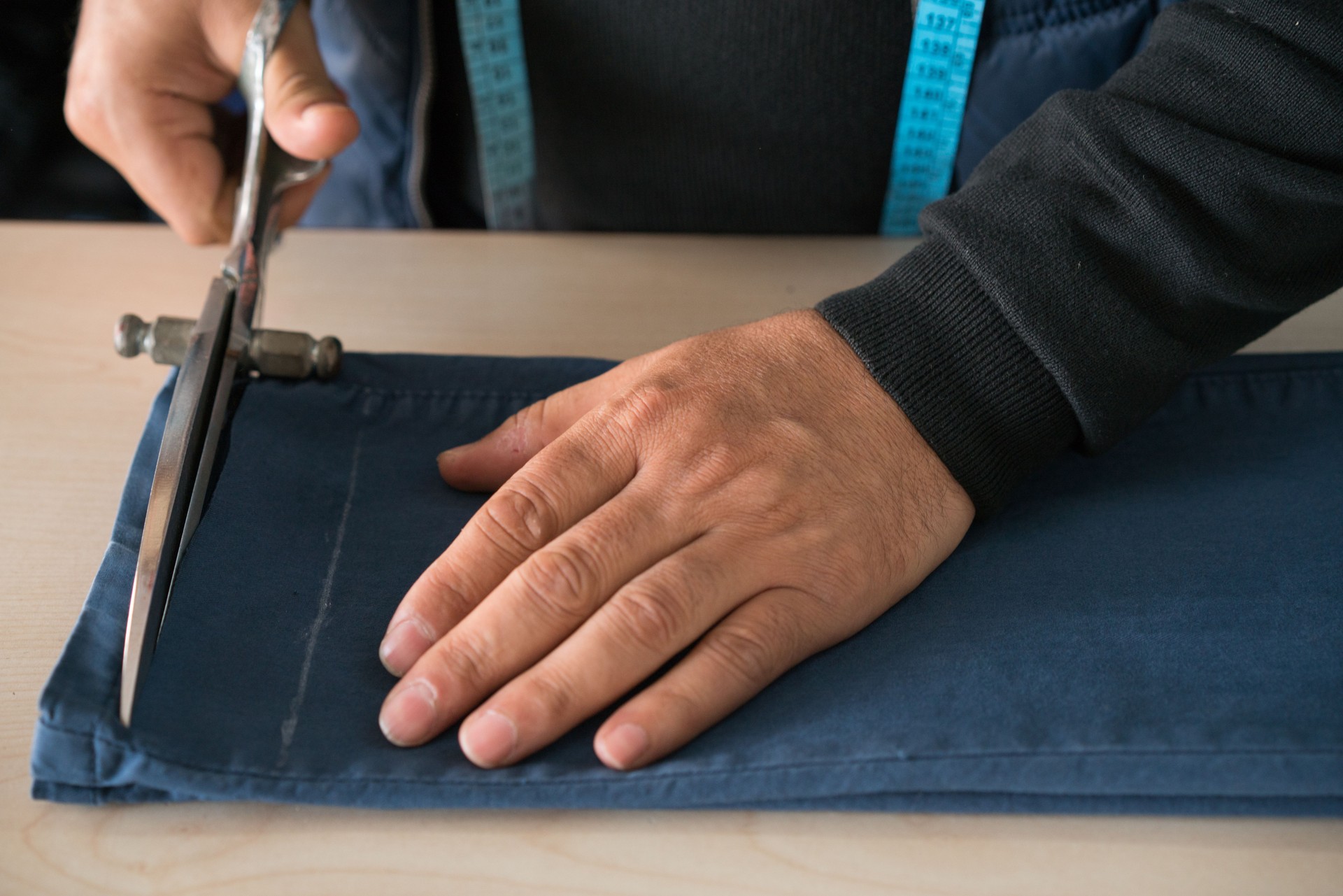 Tailor man working in his tailor shop