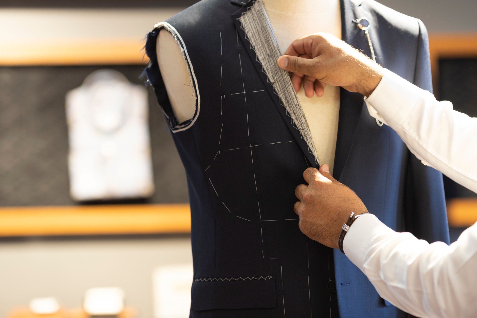 Man Measuring Jacket on Male Dress Form
