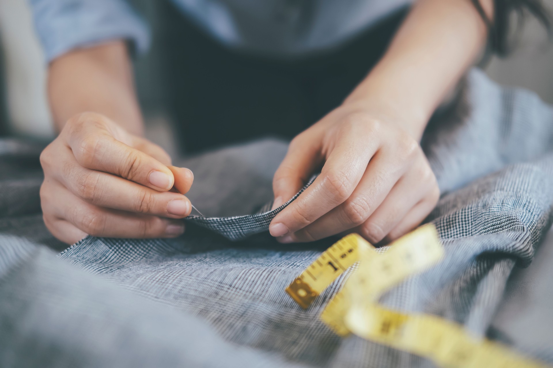 The tailor sawing the jacket