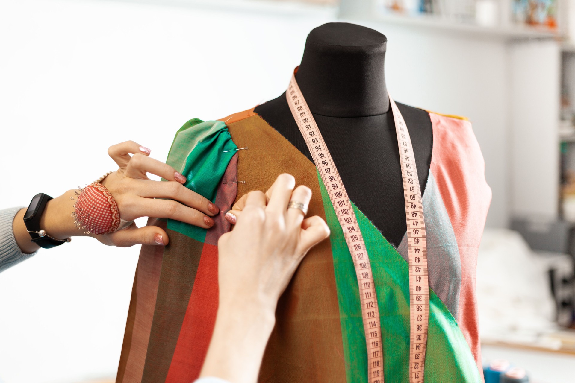 Individual tailoring of a dress. The working process of a seamstress in the atelier